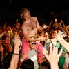 William Ocean, the pioneer of the backflip beercan crush, surfs the crowd with an air guitar solo.
